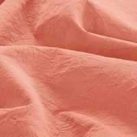 Nauwkeurige weergave van een oranje stof, met een rijke kleur en fijne vezels.